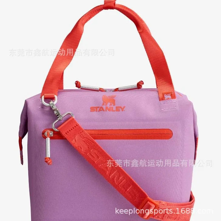 Purple insulated cooler lunch bag with an orange strap and silver hardware