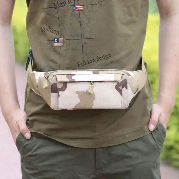 A man wearing a olive green shirt and khaki pants, holding a camouflage tactical waist bag.