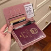 A pink leather passport wallet is shown open, displaying a passport and various cards.