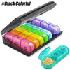 A black weekly pill organizer with seven colored compartments for a week's medication.