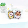 A set of cute cartoon animal resin keychain charms featuring a yellow bear and a white duck, displayed on a light blue backgr