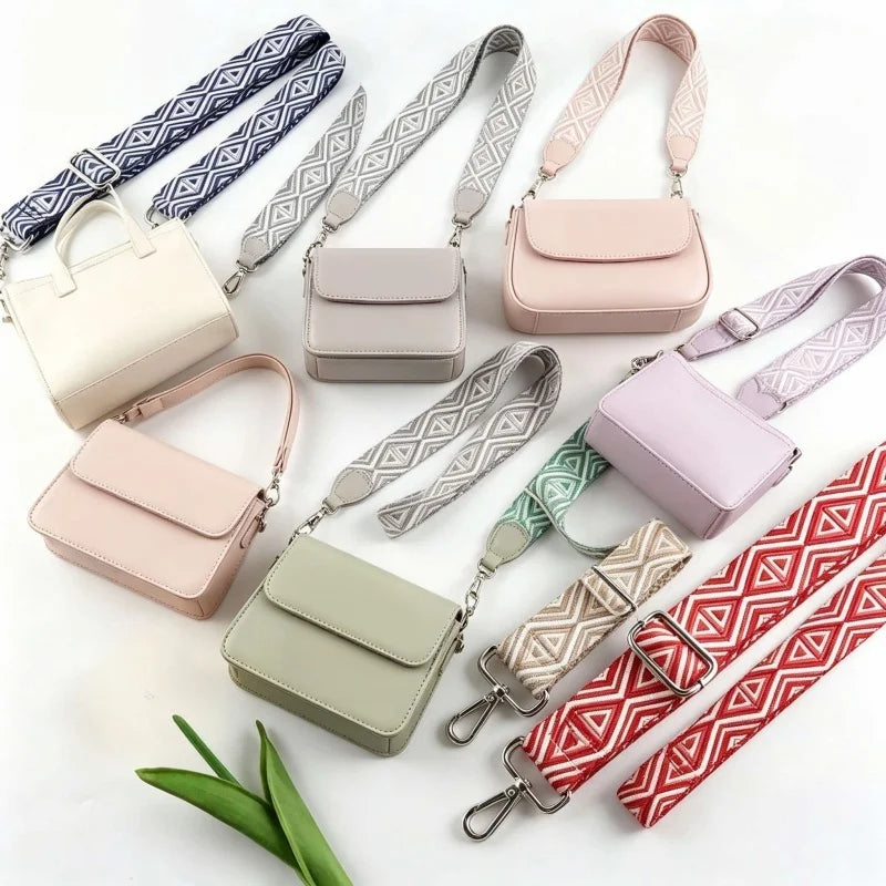 A collection of light pink, beige, and green nylon shoulder straps for various bags and purses.