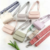 A collection of light pink, beige, and green nylon shoulder straps for various bags and purses.