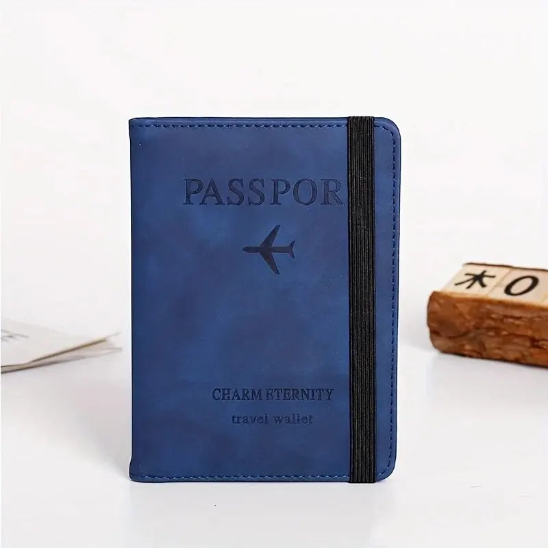 A dark blue passport wallet with a black trim and a silver airplane icon is shown on a white surface.