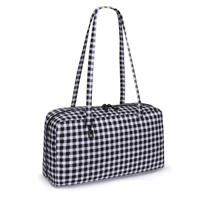 A black and white checkered nylon shoulder tote bag with long straps.