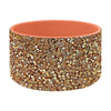 A durable silicone boot sleeve for water bottles in a matte terracotta color with a gold glitter pattern.