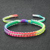 Handmade braided rope bracelet featuring colorful strands of green, purple, pink, and yellow.
