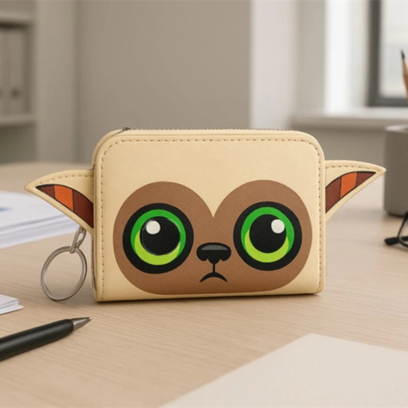 A beige Loungefly avatar wallet shaped like a cartoon monkey with large green eyes and pointed ears.
