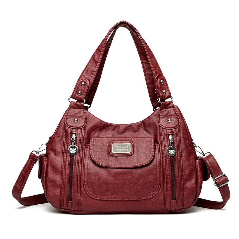 Maroones Vintage Soft PU Leder-Schultertasche mit silberner Hardware und Klappverschluss.