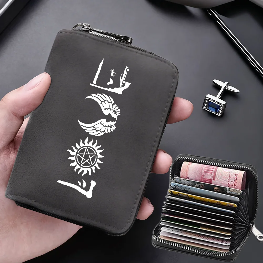 A hand holds a dark gray compact RFID-blocking card wallet with 11 slots and a separate small card holder.