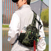 A person wearing a white jacket is holding a tactical fishing gear storage chest bag with camouflage fabric and various acces