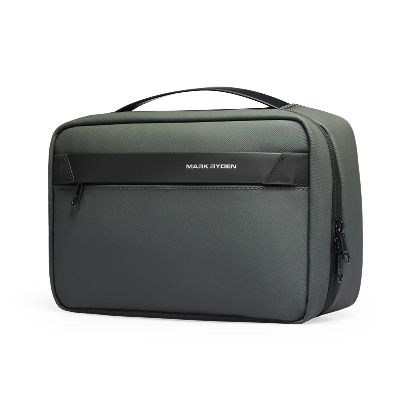 A dark gray travel toiletry organizer bag with a black handle and a subtle logo detail.