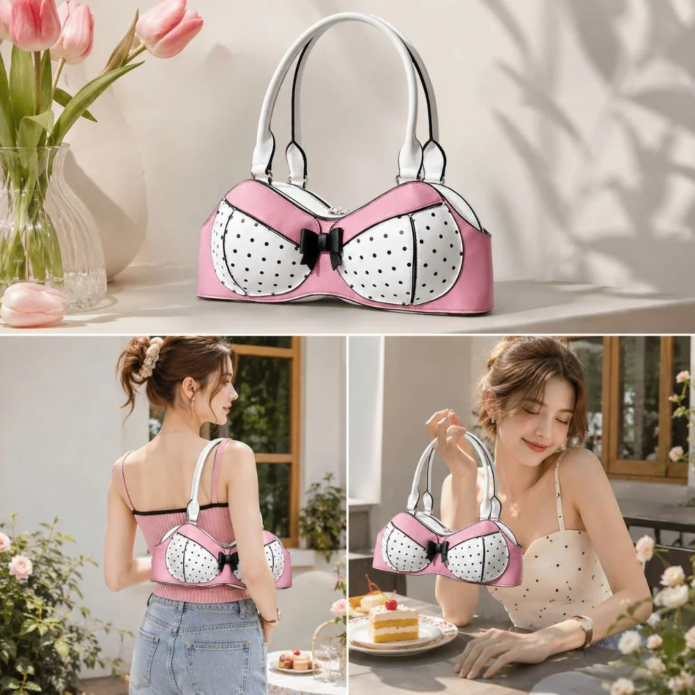 A pink and white polka dot bow shoulder bag with a playful bra silhouette displayed on a light surface.