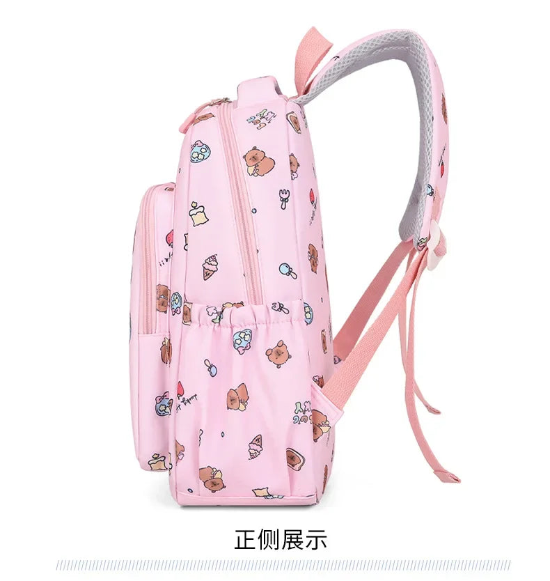 A pink cartoon animal backpack with a gray strap and multiple compartments.