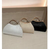 Three pleated glitter evening handbags in white, beige, and black displayed on a light surface.