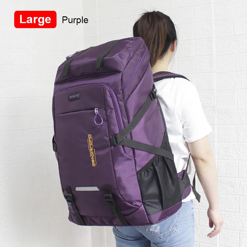 A purple large capacity travel backpack with a black rain cover is shown on a person's back.