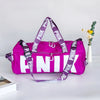 A bright purple Nike pink shoulder bag with white text is displayed on a white surface next to a small vase of yellow flowers