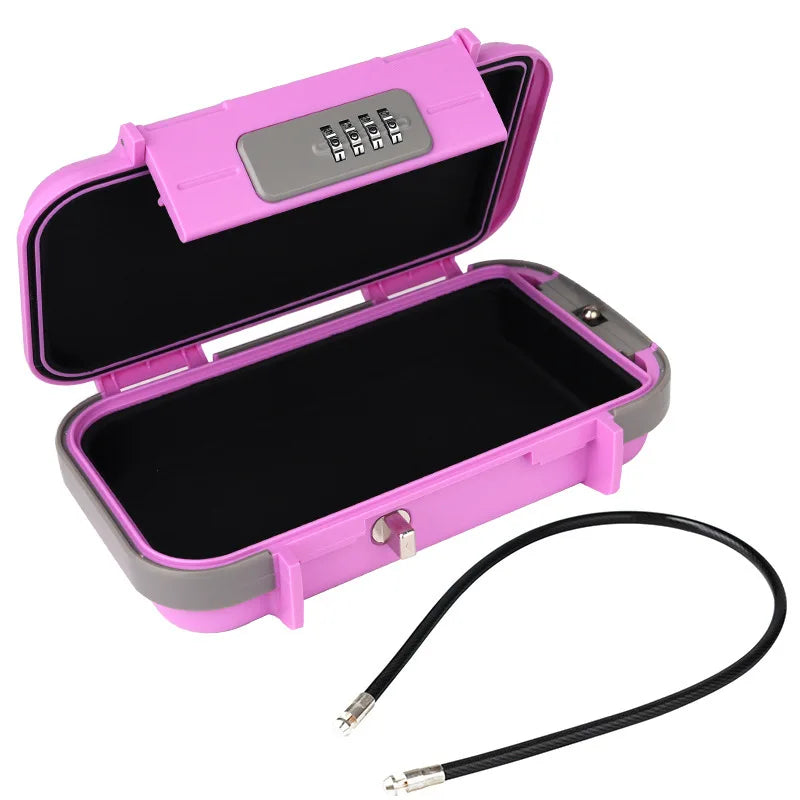 A pink portable travel lock box with a lid open, showing the interior and an attached black cable.