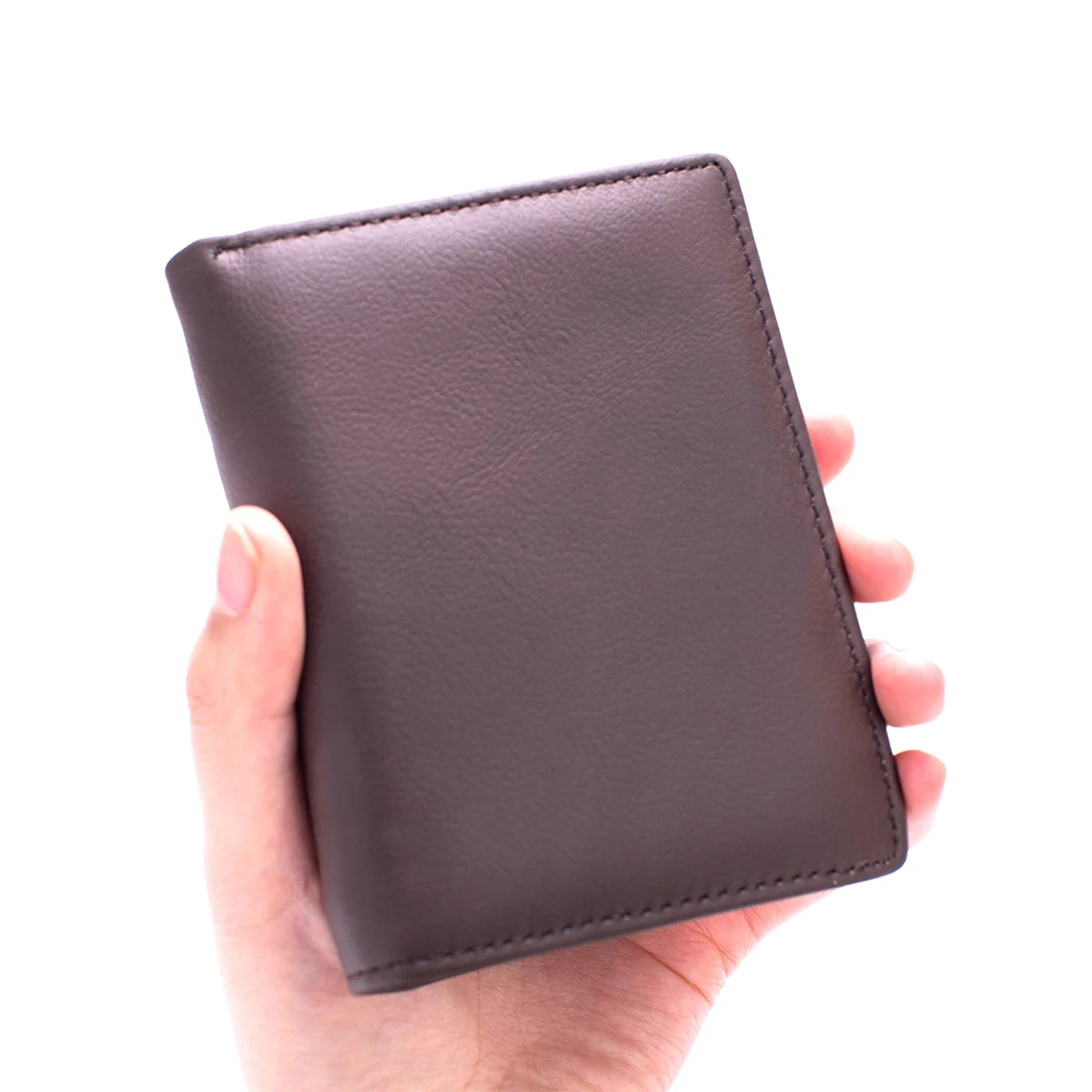 A hand holds a dark brown genuine leather men's business wallet with a zipper.