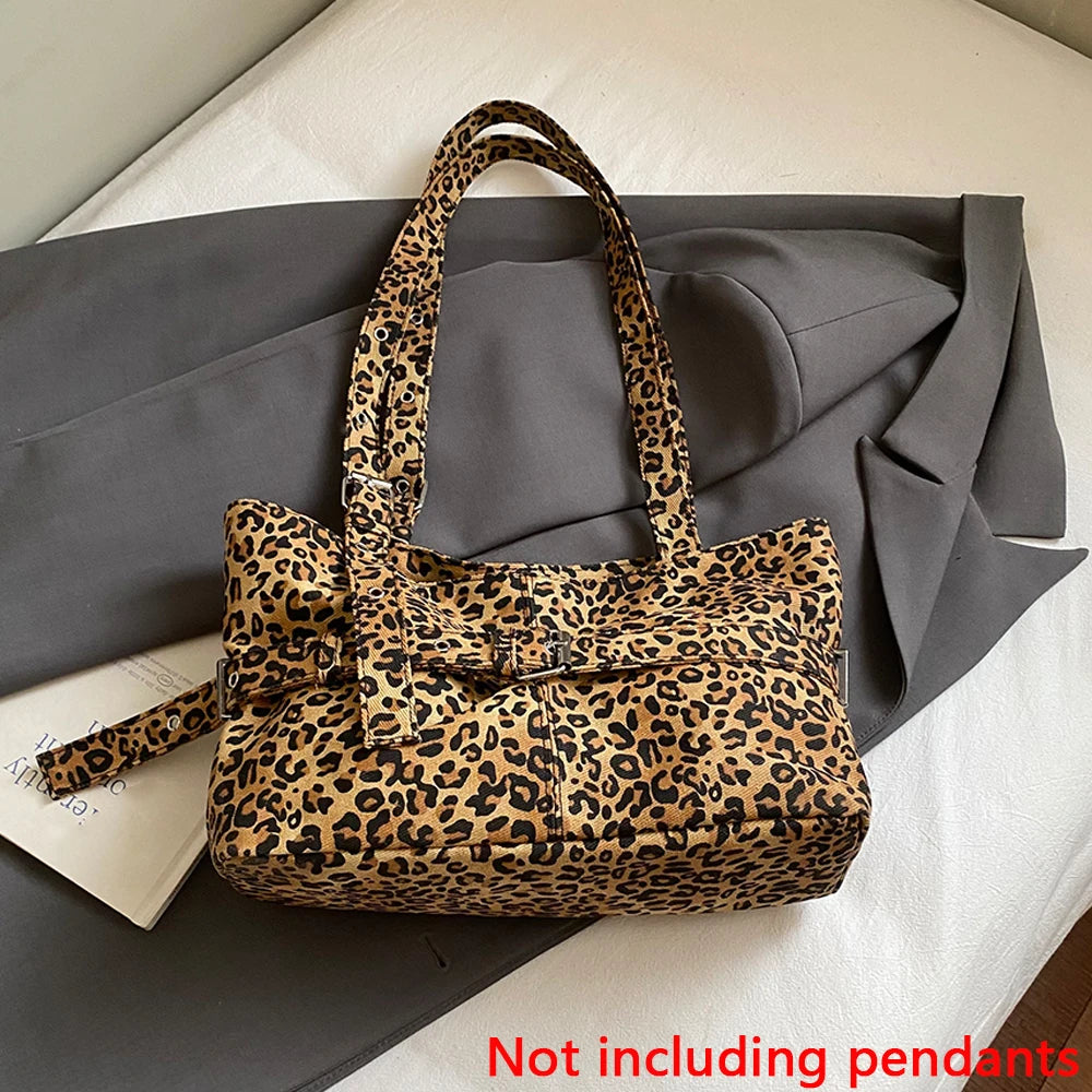 A leopard print casual tote bag resting on a gray fabric background.