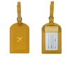A pair of mustard yellow PU leather luggage tags with silver clasps and a beige card holder.