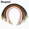 A set of replaceable leather bag handles in various colors including black, brown, pink, and white with metal buckles.