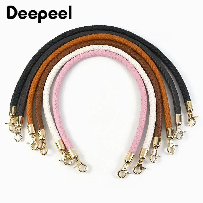 A set of replaceable leather bag handles in various colors including black, brown, pink, and white with metal buckles.