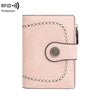 A light pink RFID protection multi-card wallet with perforated edges and a leather flap.