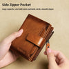 A hand holds a brown leather side zipper pocket wallet with a smooth zipper.