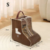 A brown portable waterproof boot storage bag with a handle is shown on a light rug.