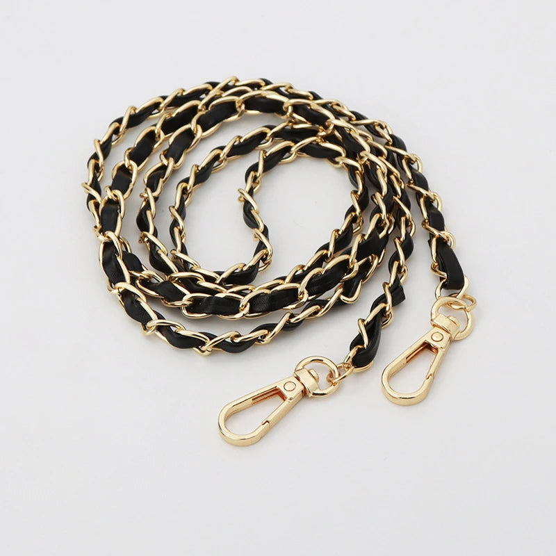 Gold and black leather chain strap for an adjustable crossbody purse.