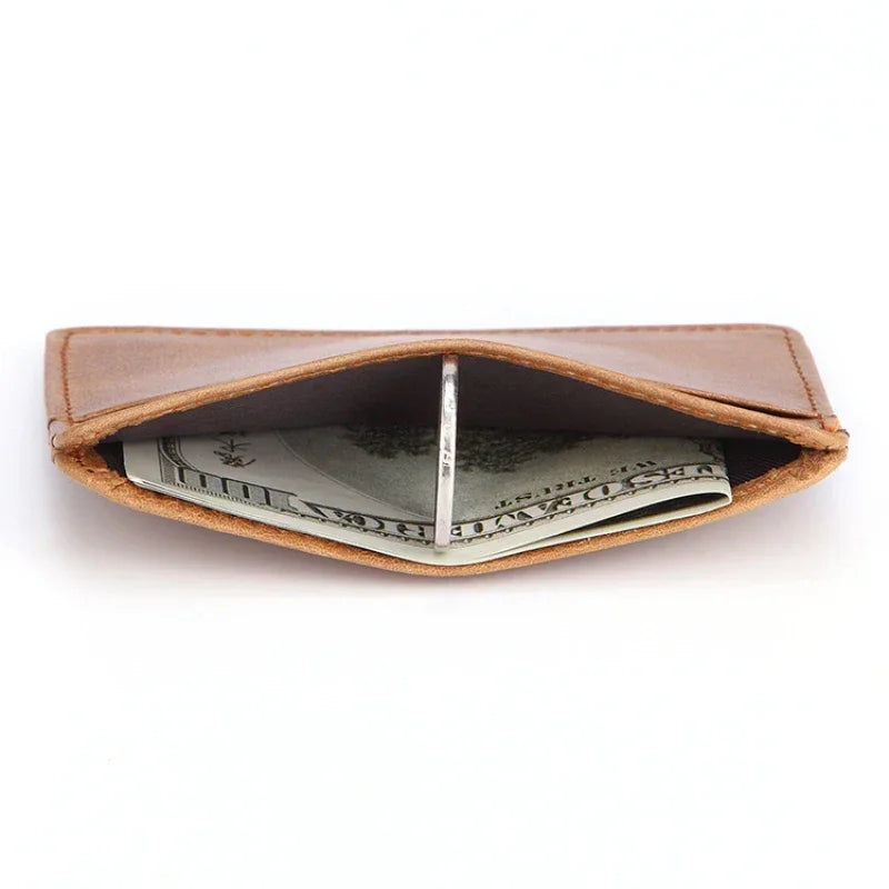 A brown genuine leather card holder with a slot displaying US dollar bills.