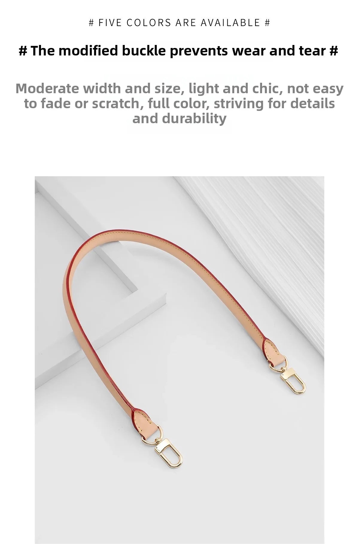 A close-up view of a tan leather shoulder strap with a modified buckle, displayed against a white background.
