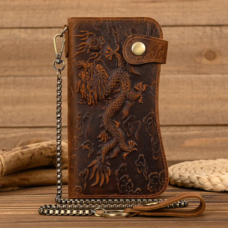 A brown genuine leather bifold wallet featuring an embossed dragon design and a metal chain.