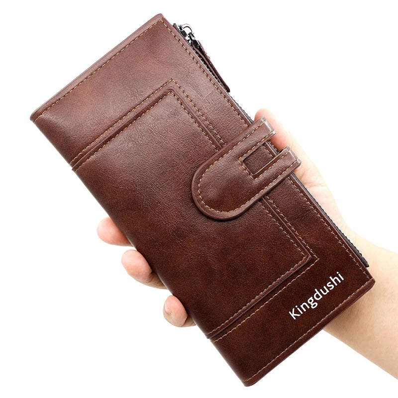 A brown leather wallet is held in a hand, showing its design and stitching.