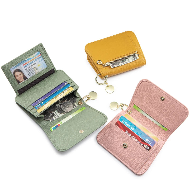 A collection of three genuine leather slim tri-fold wallets in yellow, olive green, and pink.