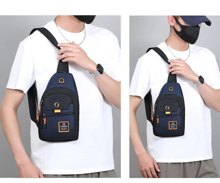 A person wearing a white t-shirt is holding a navy blue compact Oxford crossbody sling bag.