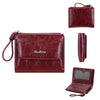 A maroon faux leather mini wallet with a leather strap and a matching card holder is shown.