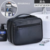 Black portable PU leather cosmetic organizer bag with a zippered compartment and included grooming tools
