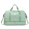 A light mint green expandable nylon travel duffle bag with padded straps and a zipper closure.