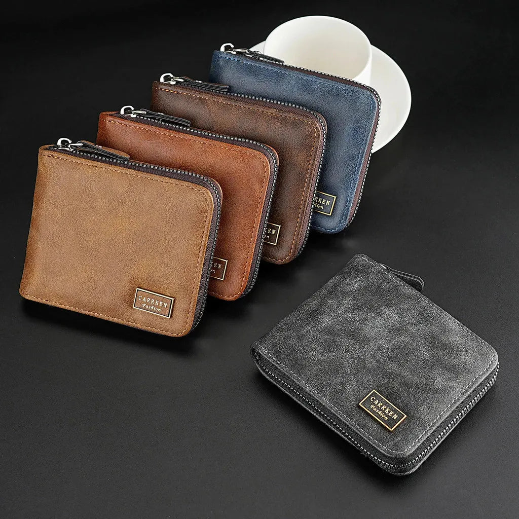 A collection of leather zipper wallets in brown, navy blue, and gray colors displayed on a dark surface.