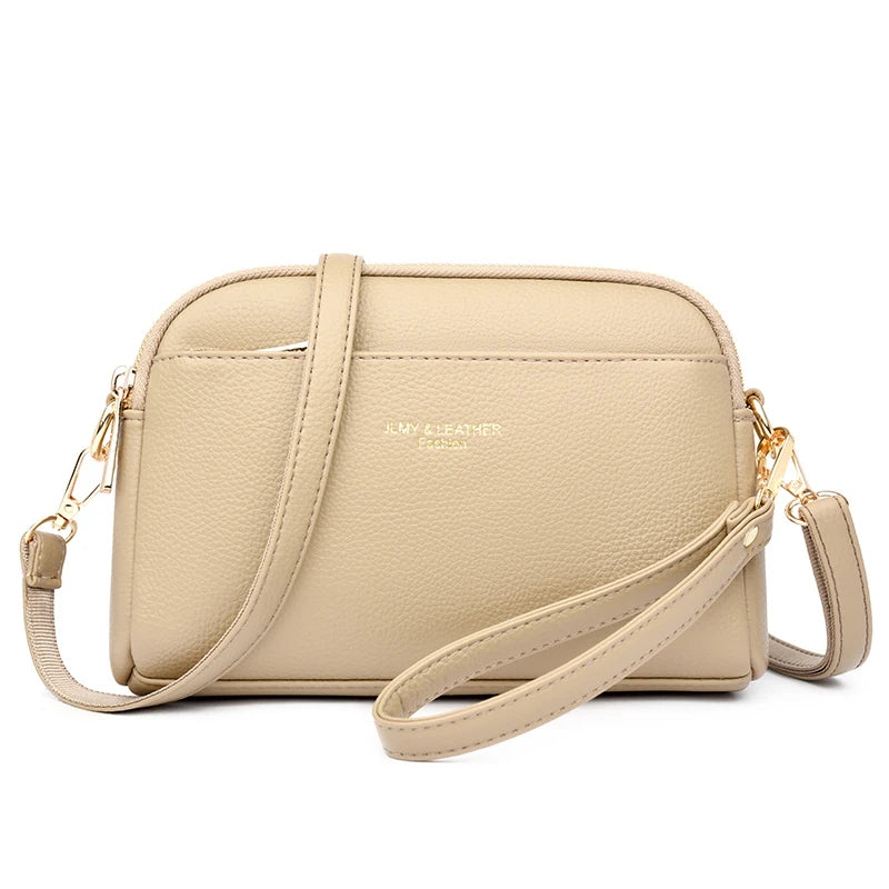 A beige PU leather trendy shoulder crossbody bag with gold hardware.