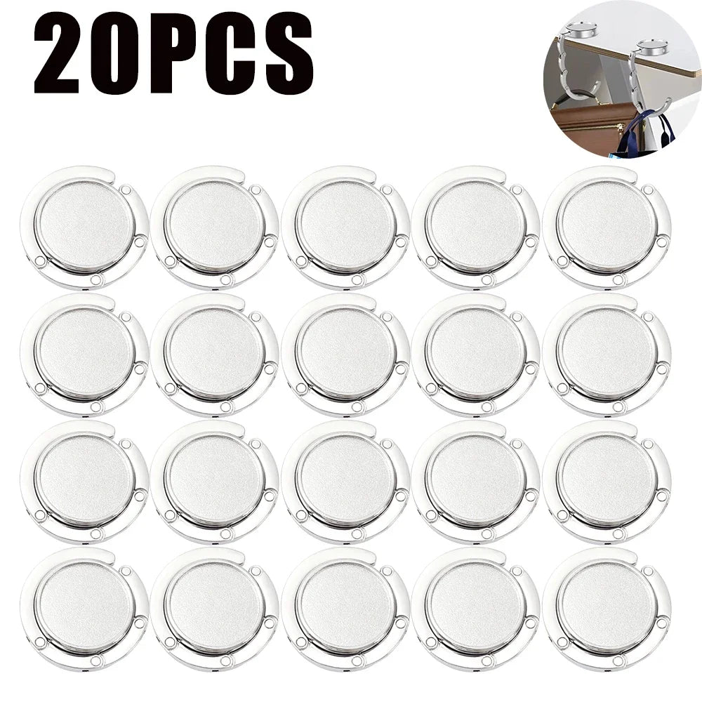 20 ganchos plegables de color plateado para organizar mesas y bolsos