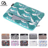 A collection of various patterned laptop sleeves and covers for different devices.