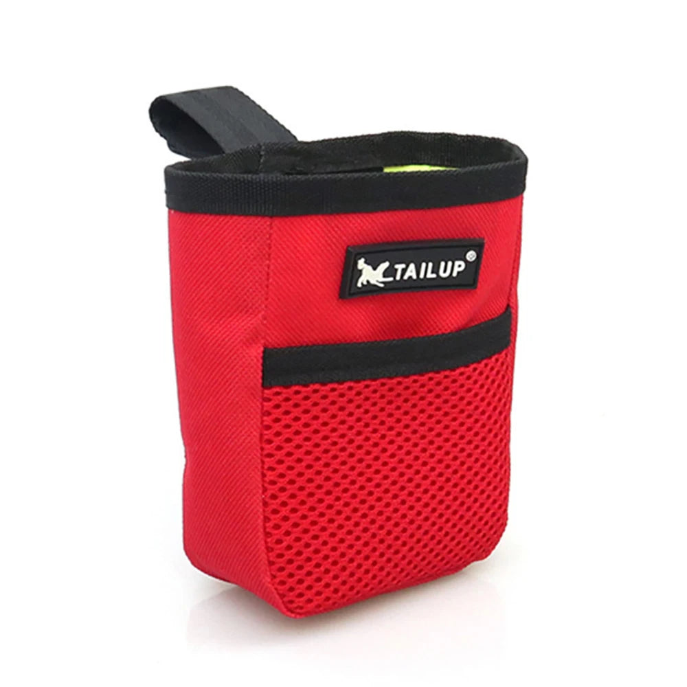 A red pet training treat pouch for dogs with black trim and a logo on the front.
