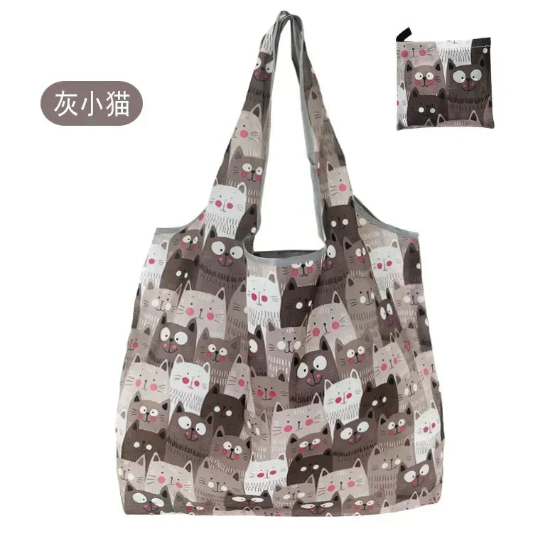 A reusable fashion shopping tote bag featuring a pattern of cute cats in various shades of gray and brown.