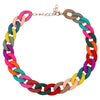 A colorful acrylic statement choker necklace featuring interlocking links in shades of pink, green, blue, and brown.