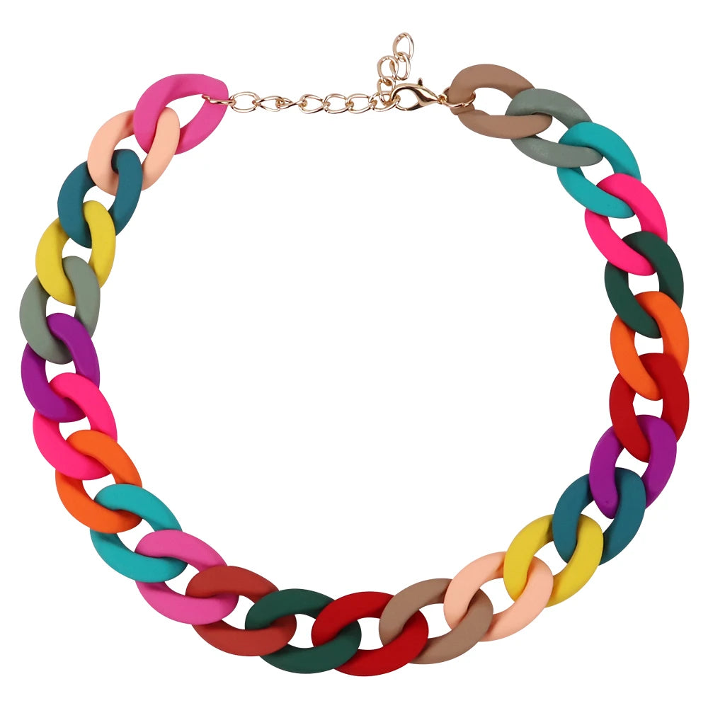 A colorful acrylic statement choker necklace featuring interlocking links in shades of pink, green, blue, and brown.