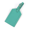 A teal PU leather luggage tag with a silver clasp attached to a strap.