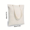 Sac en toile de coton blanc avec anses beige clair, vu de face.